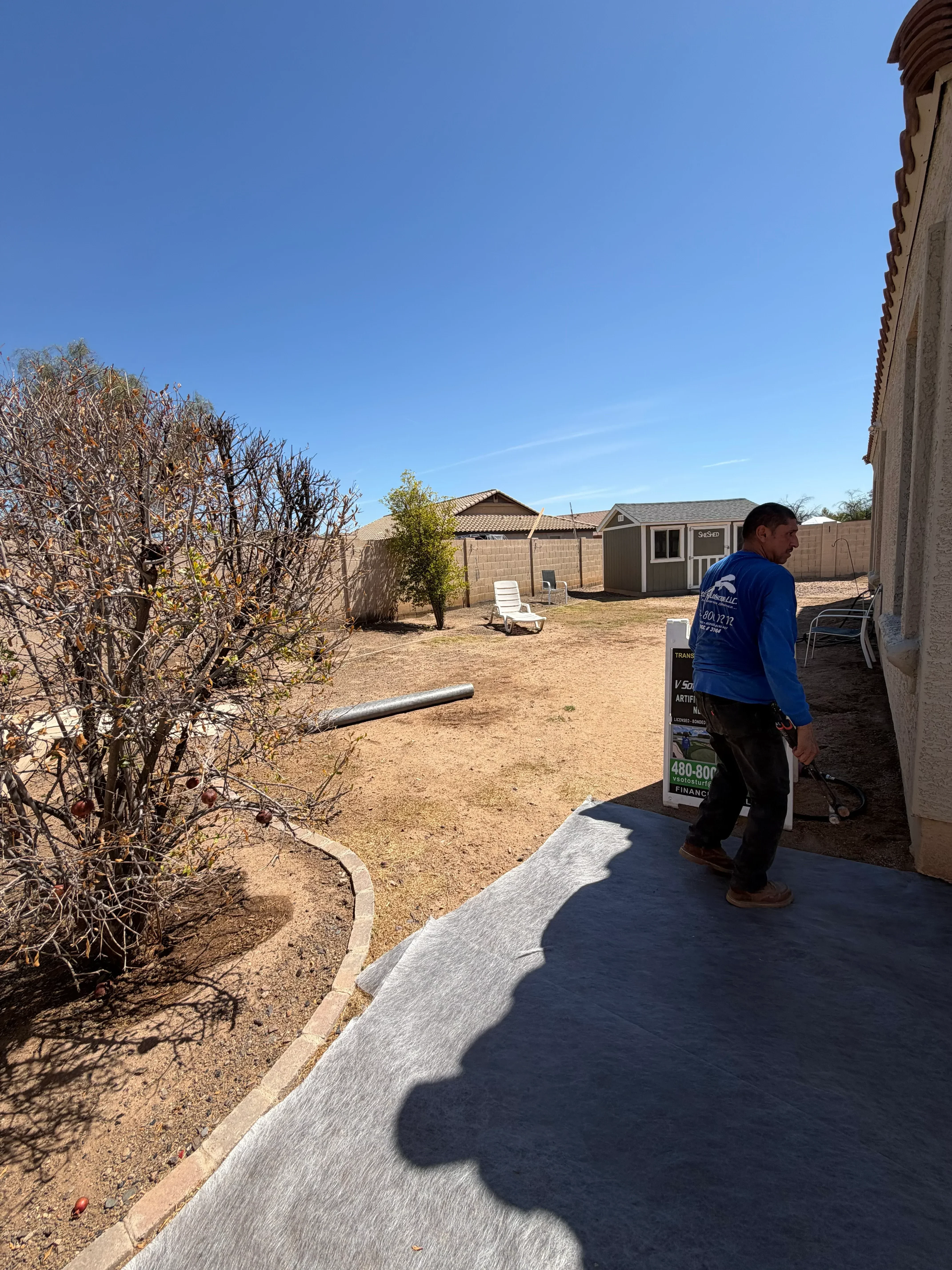Residential grading work with compacted soil, French drain installation, and landscape preparation